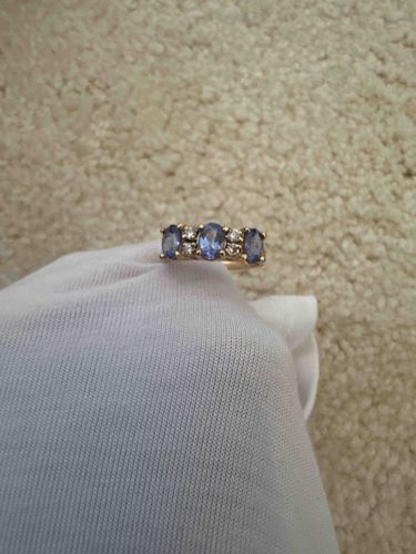 Tanzanite and Diamond Three-Stone Band in Yellow Gold