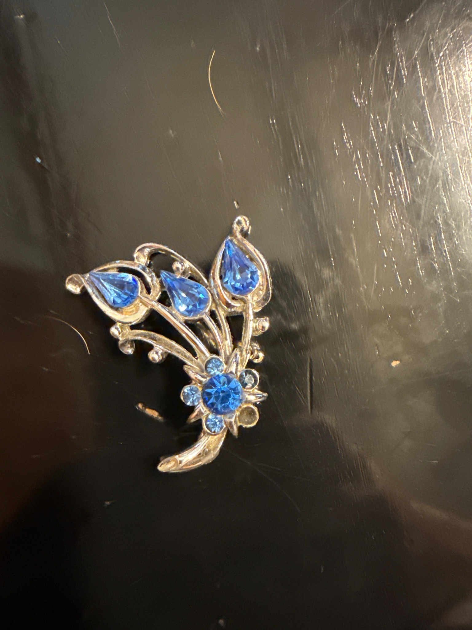 Submitted photo of Vintage blue rhinestone floral brooch