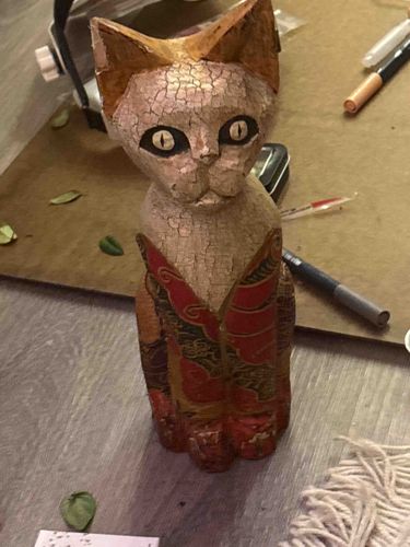Carved Wooden Cat Figurine with Painted Detail