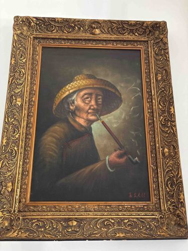 East Asian Portrait of an Elderly Man Smoking a Pipe