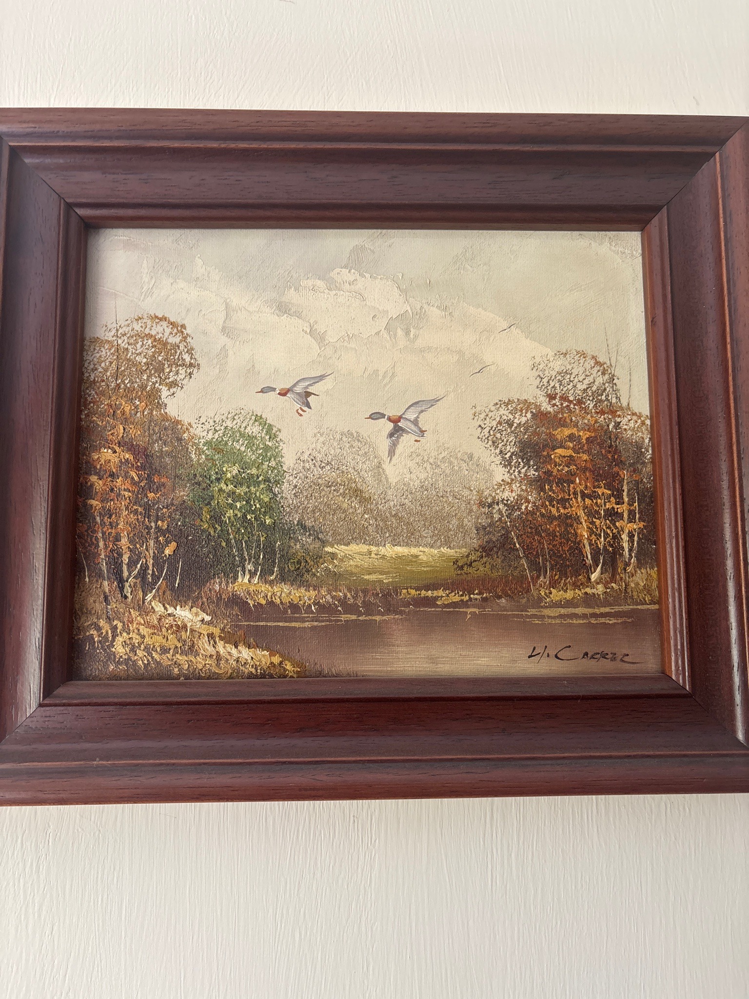 Submitted photo of Oil landscape signed 'H. Carter'