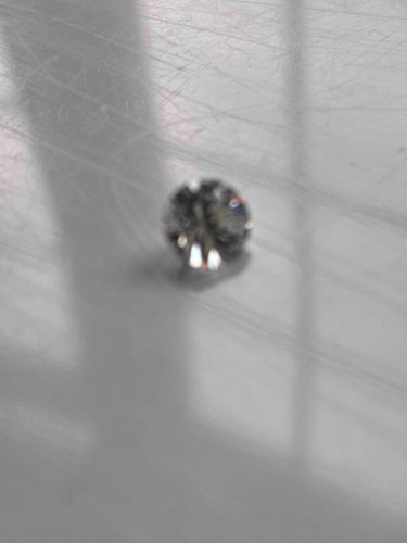 Loose Faceted Gemstone (likely Diamond)