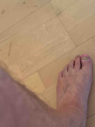 Human Foot with Flooring Background