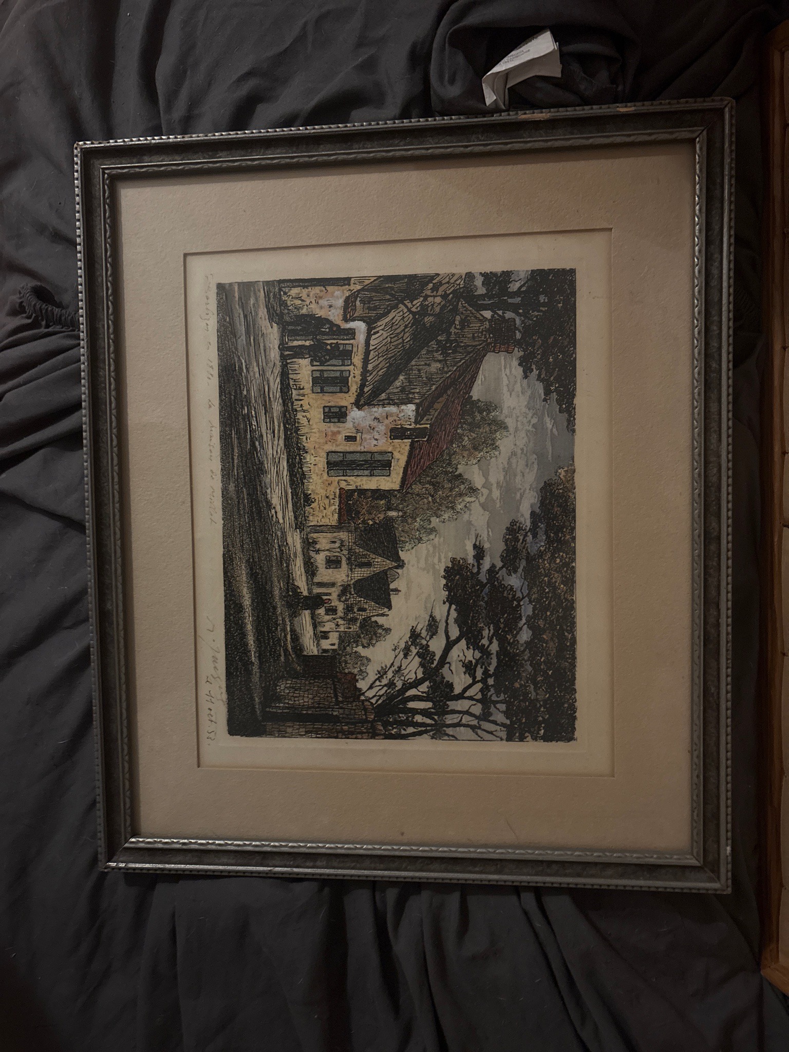 Submitted photo of Framed print depicting a rustic building scene, signed illegibly (not authenticated)