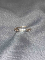 Delicate White Metal Ring with Central Geometric Design and Openwork Band
