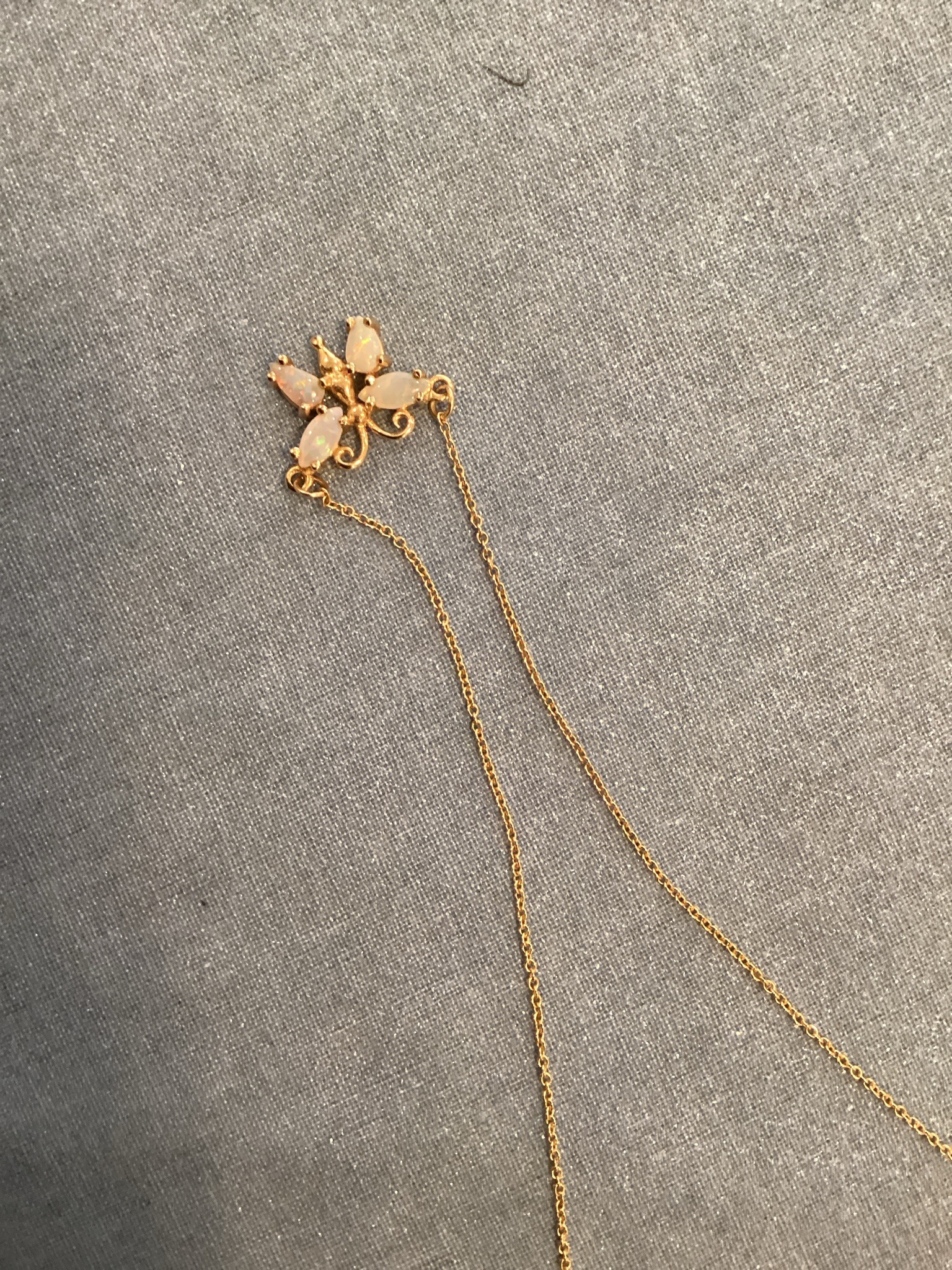Submitted photo of Opal and gold-tone butterfly pendant necklace