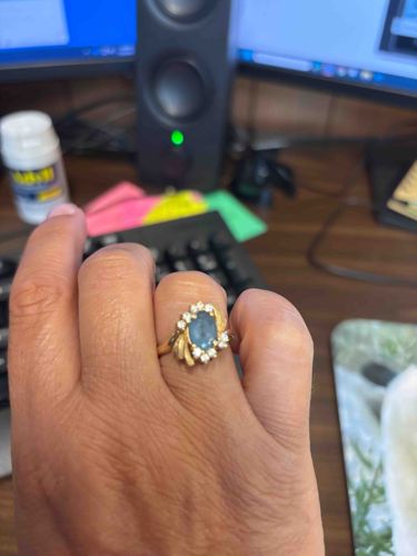 Gold Ring with Blue Gemstone and Diamond Halo