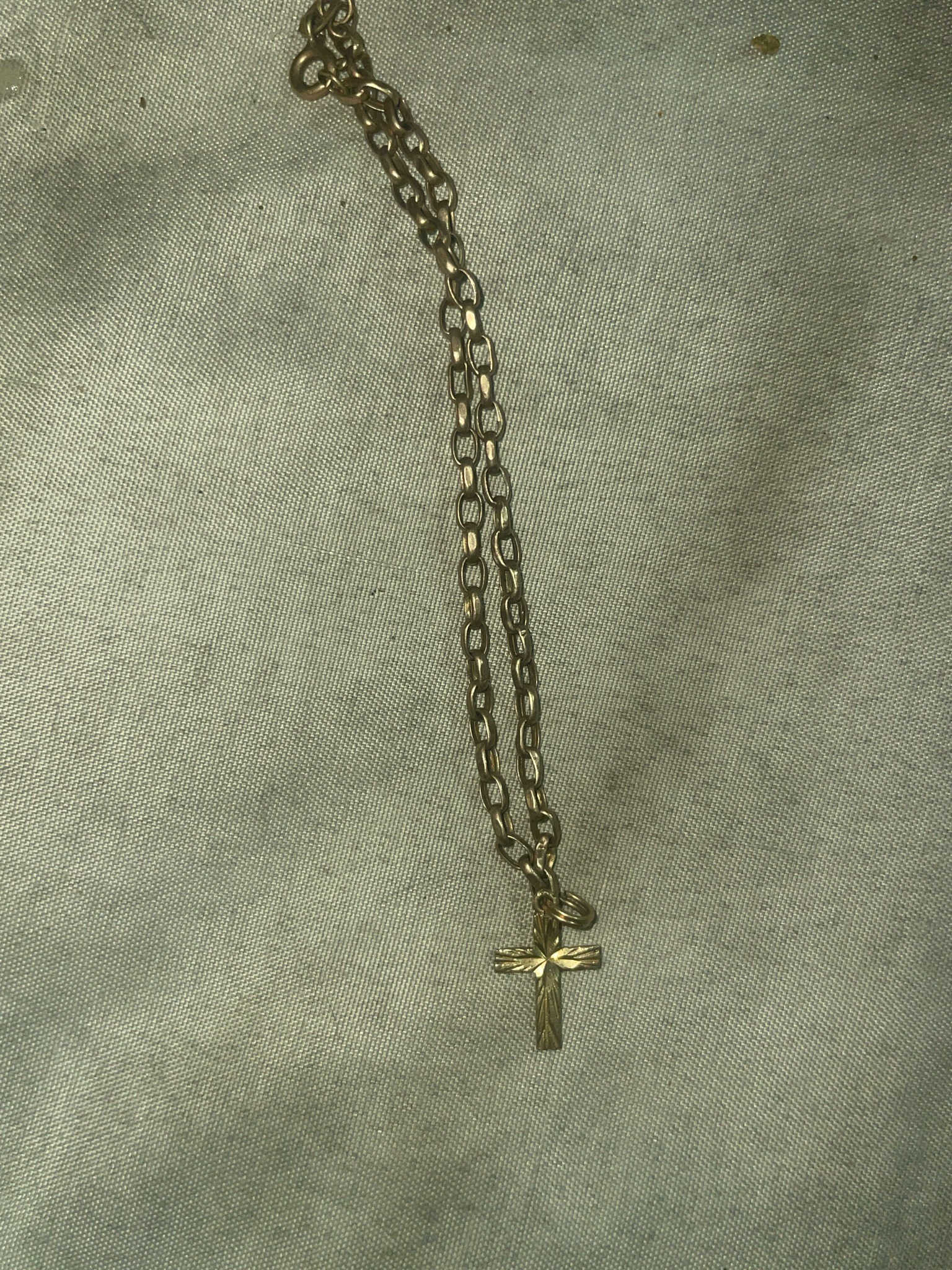Submitted photo of Gold-toned metal cross pendant necklace (not authenticated)
