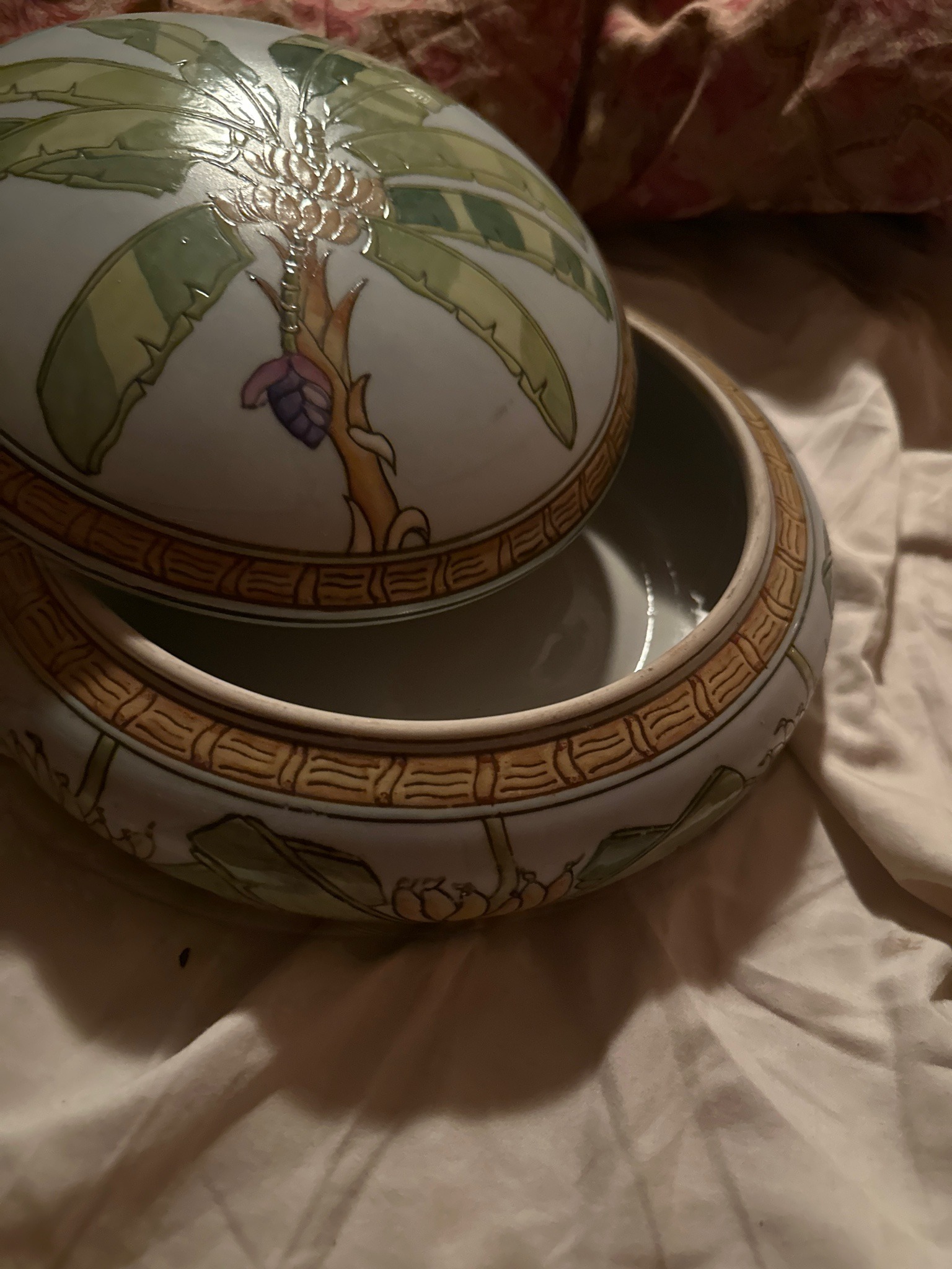 Submitted photo of Ceramic lidded bowl with hand-painted banana tree motif