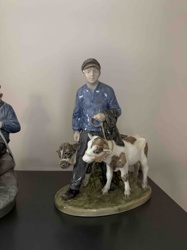Porcelain Figurine of a Boy with Calves