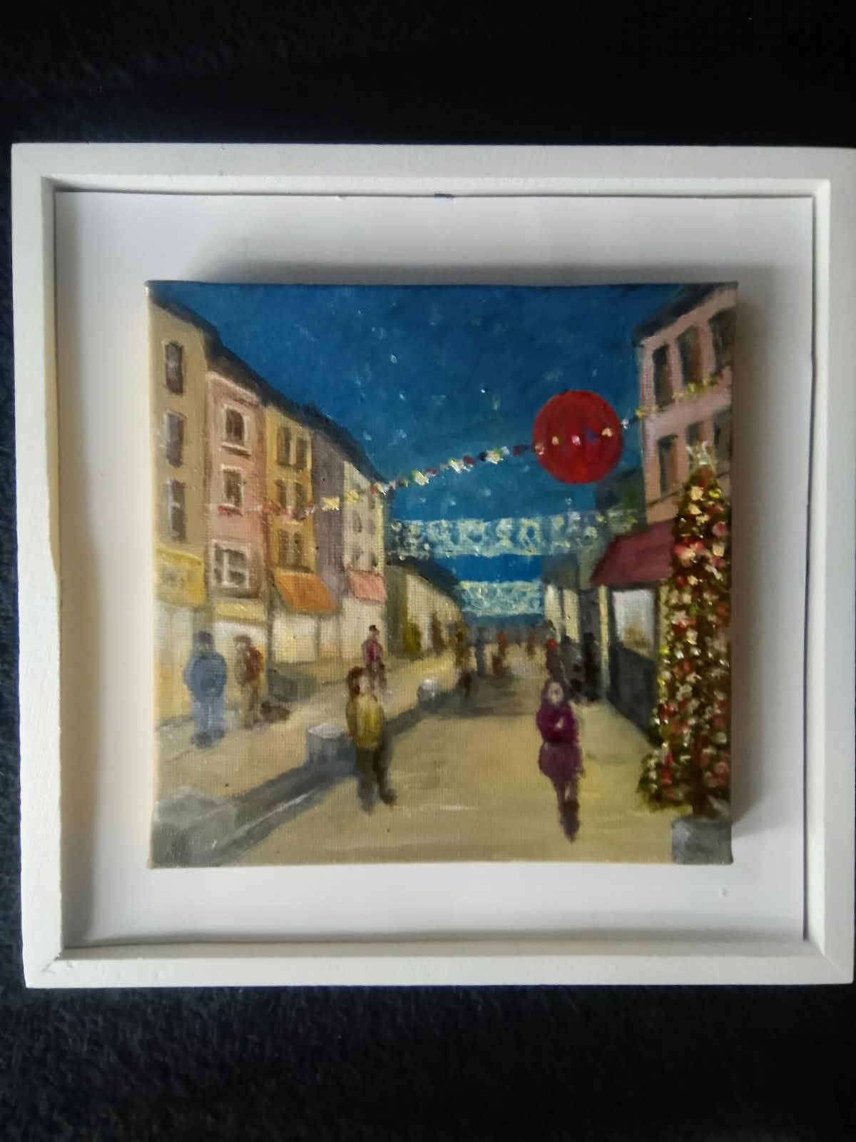 Submitted photo of Original oil painting depicting a festive European street scene