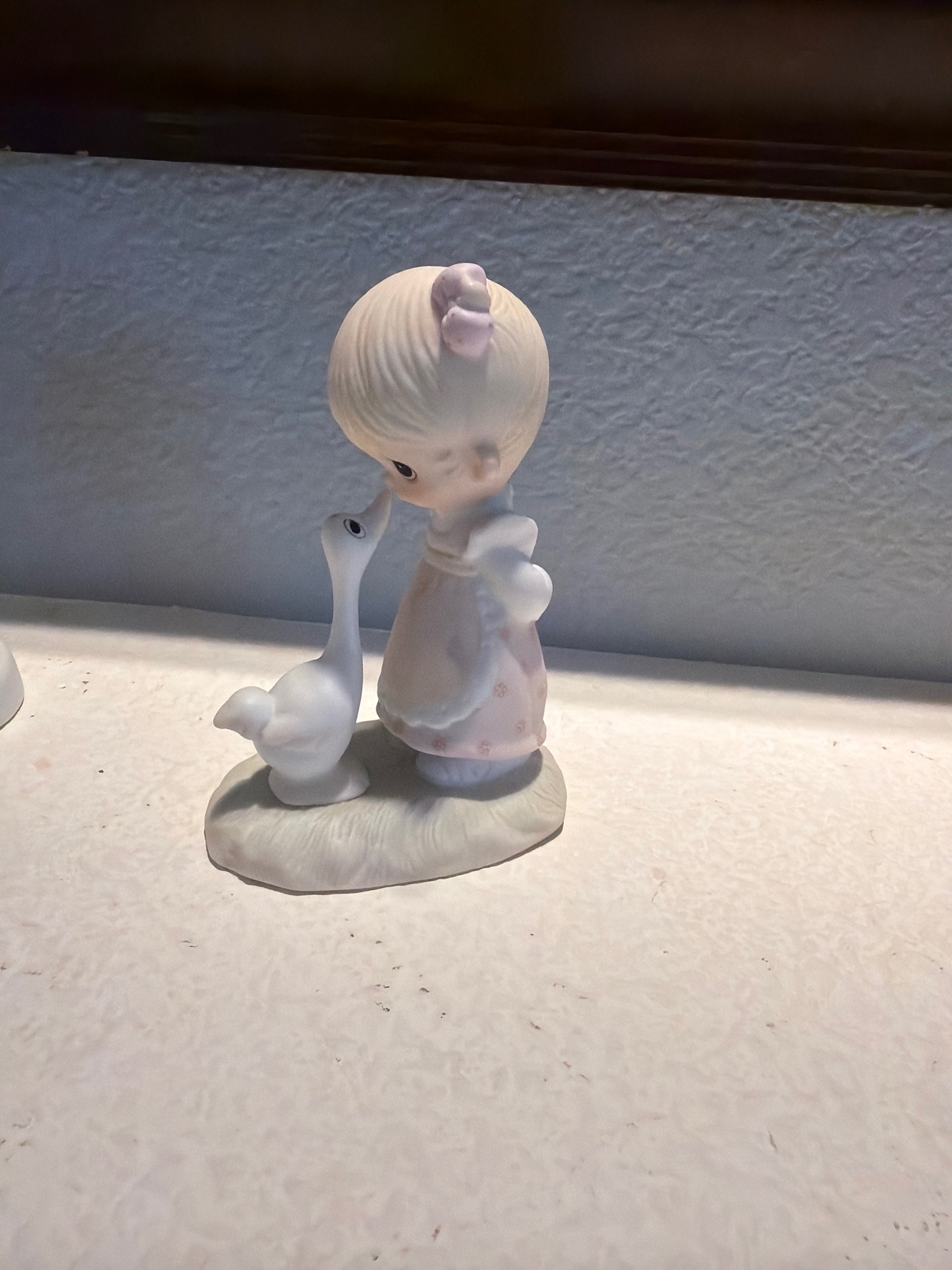 Submitted photo of Porcelain figurine, attributed to Precious Moments (not authenticated)