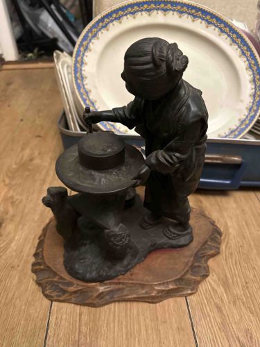 Japanese Meiji Period Cast Iron Okimono of a Woman with Millstone