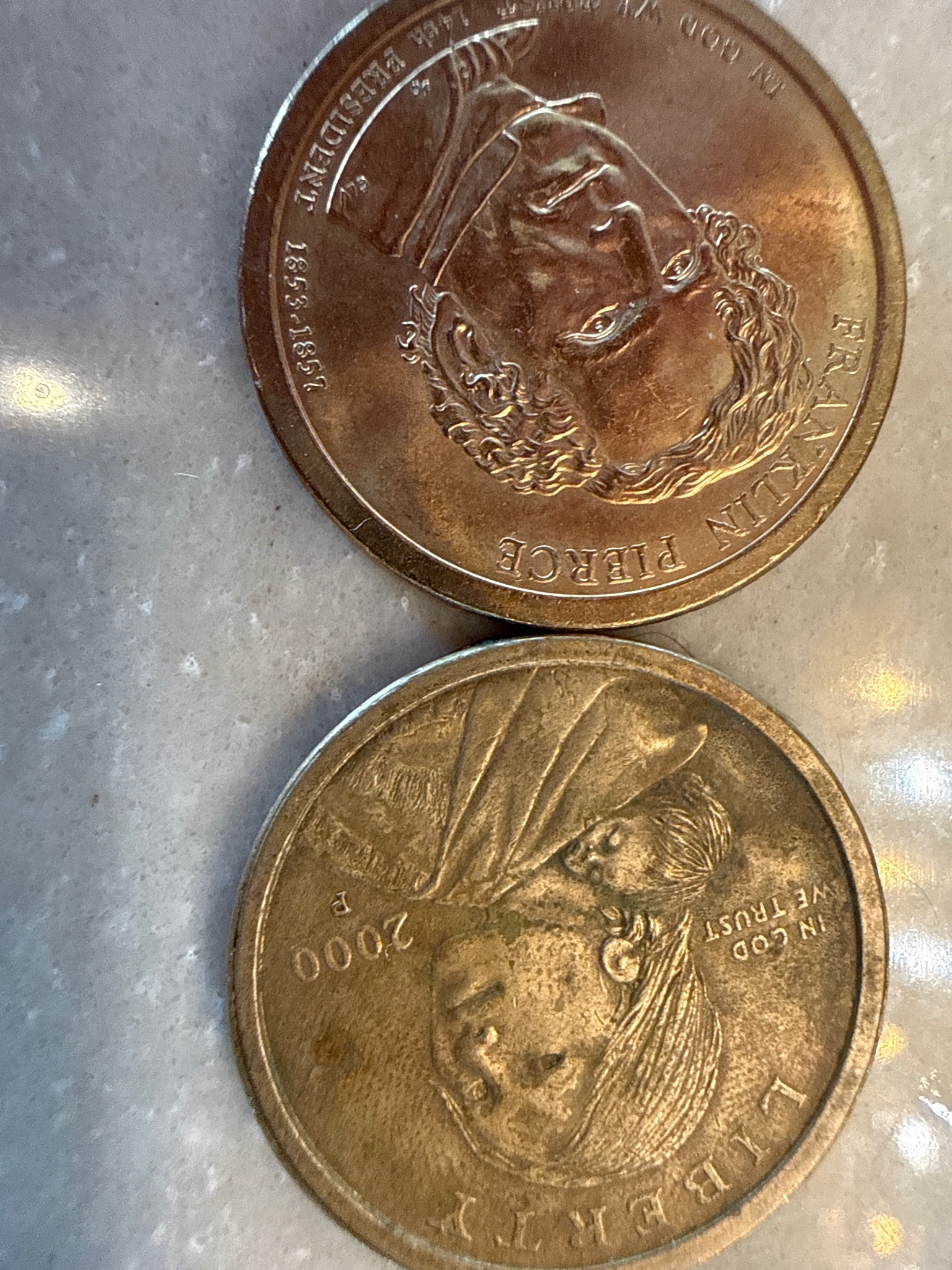Submitted photo of Pair of United States Golden-Colored One Dollar Coins