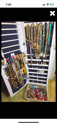 White Jewelry Armoire with Extensive Jewelry Collection