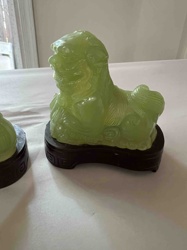 Pair of Jadeite-like Foo Dog Figurines on Wood Stands