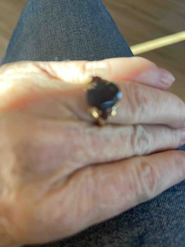 Oval Dark Gemstone Ring with Red Accents