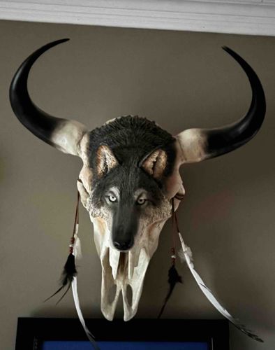 Buffalo Skull with Wolf Effigy and Feather Adornments