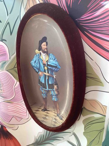 19th Century Hand-Painted Oval Porcelain Plaque featuring a Renaissance Cavalier