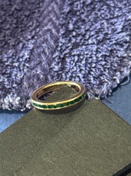 Gold-Toned Eternity Ring with Emerald Green Stones