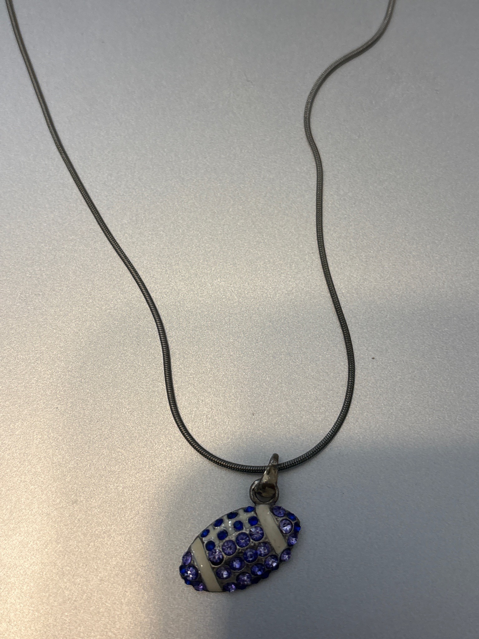 Submitted photo of Football-shaped rhinestone pendant necklace