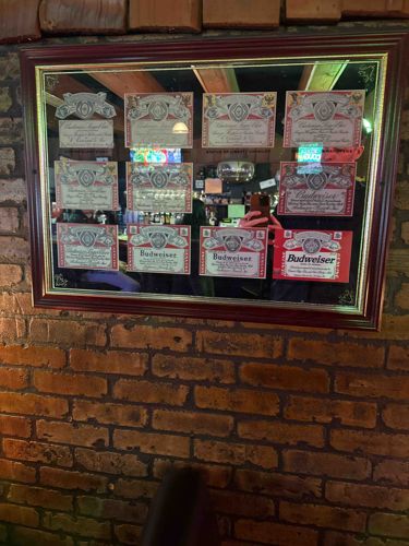 Framed Collection of Vintage Budweiser Labels on Mirror