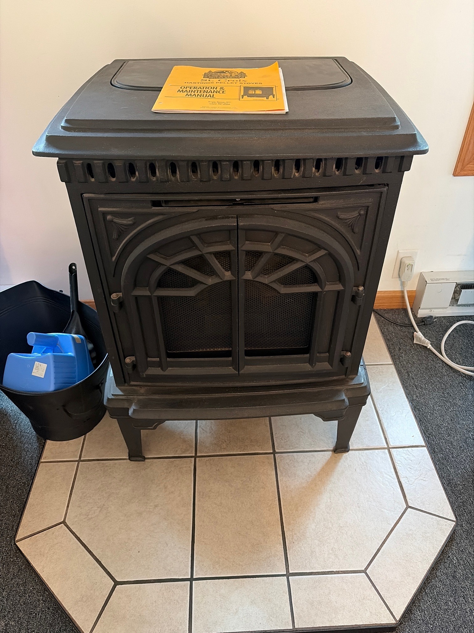 Submitted photo of Pellet stove with manual bearing a 'St. Croix' logo (not authenticated)