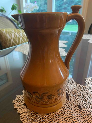 Brown Glazed Ceramic Pitcher with Embossed Decoration
