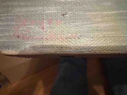 Aged Canvas with Faint Reddish Markings