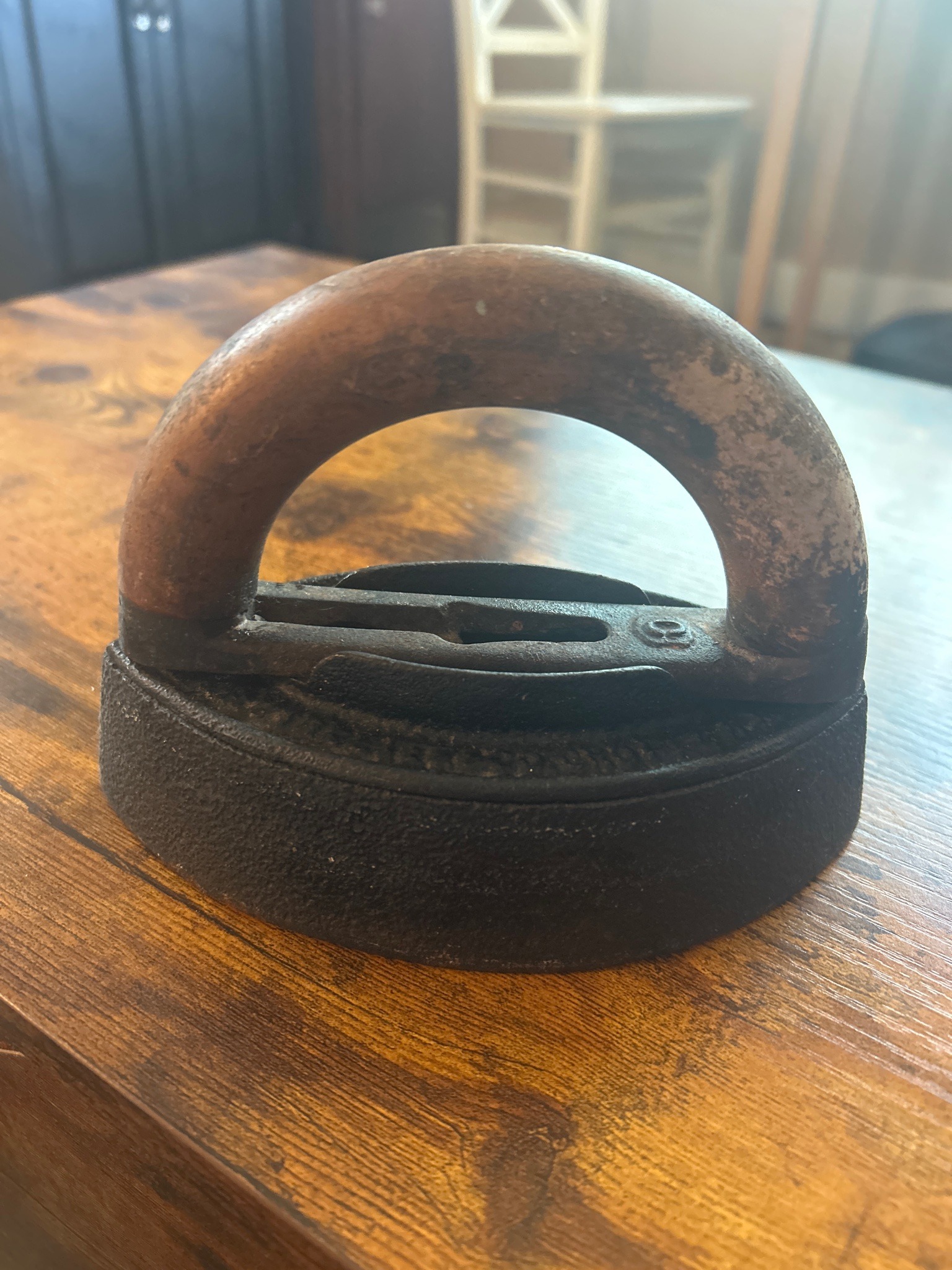 Submitted photo of Cast iron sad iron with a turned wooden handle