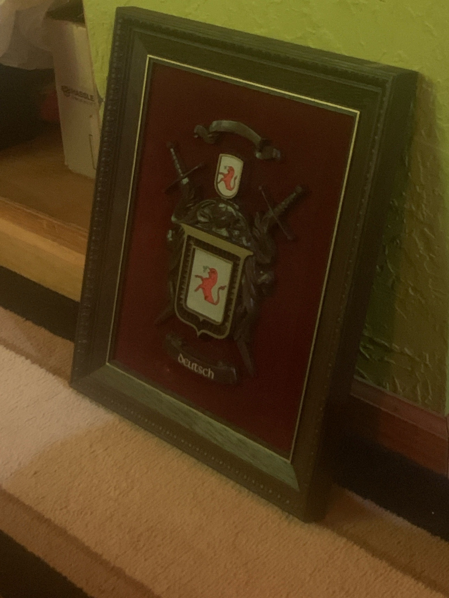 Submitted photo of Framed coat of arms wall plaque bearing the name 'Deutsch'