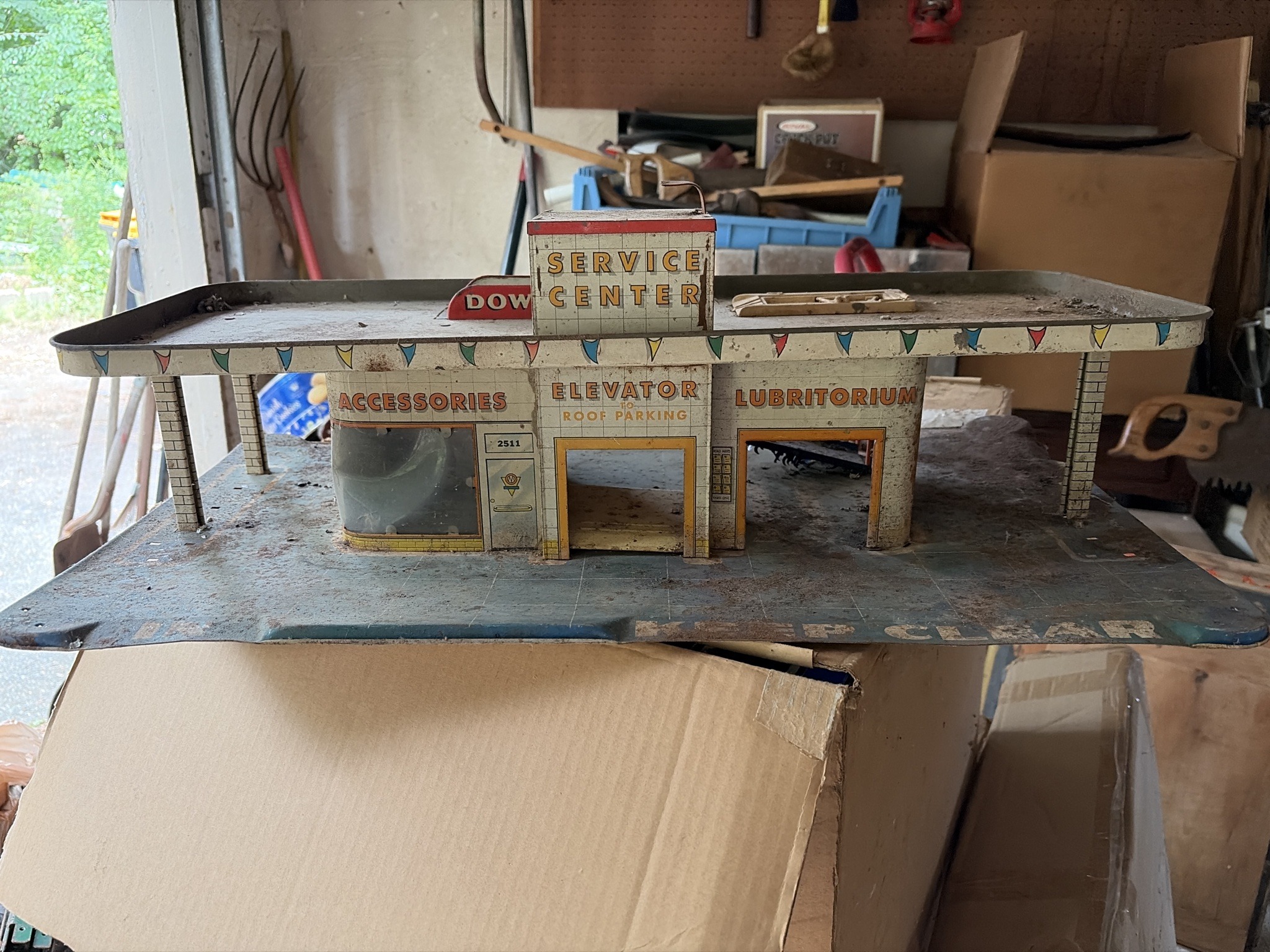 Submitted photo of Lithographed tin toy service station (unauthenticated)