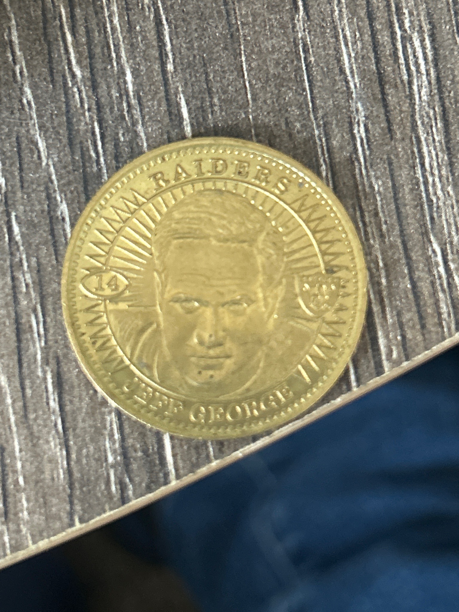 Submitted photo of Gold-toned metal novelty coin featuring Jeff George (not authenticated)