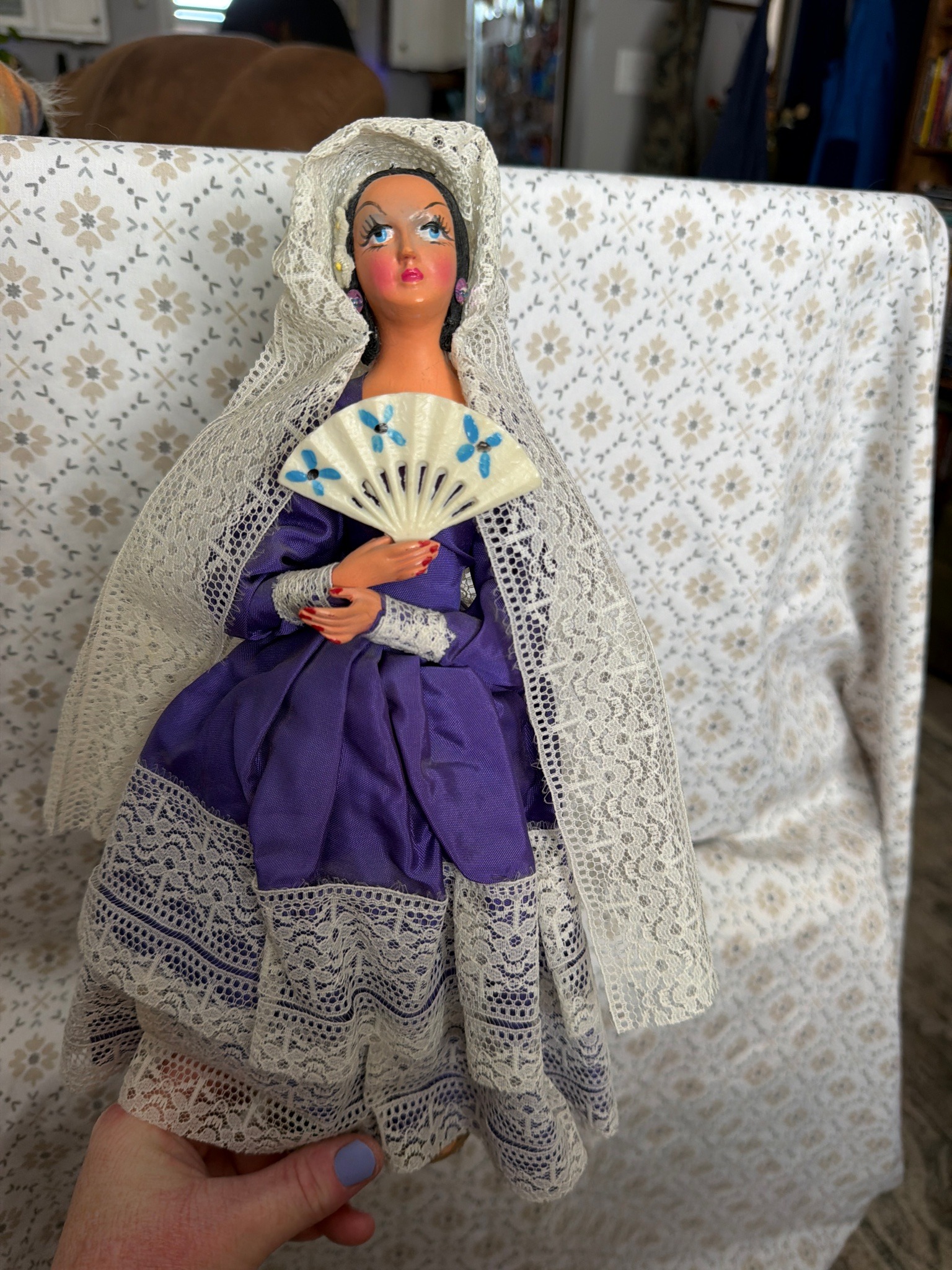 Submitted photo of Souvenir costume doll wearing a traditional Spanish mantilla and holding a fan