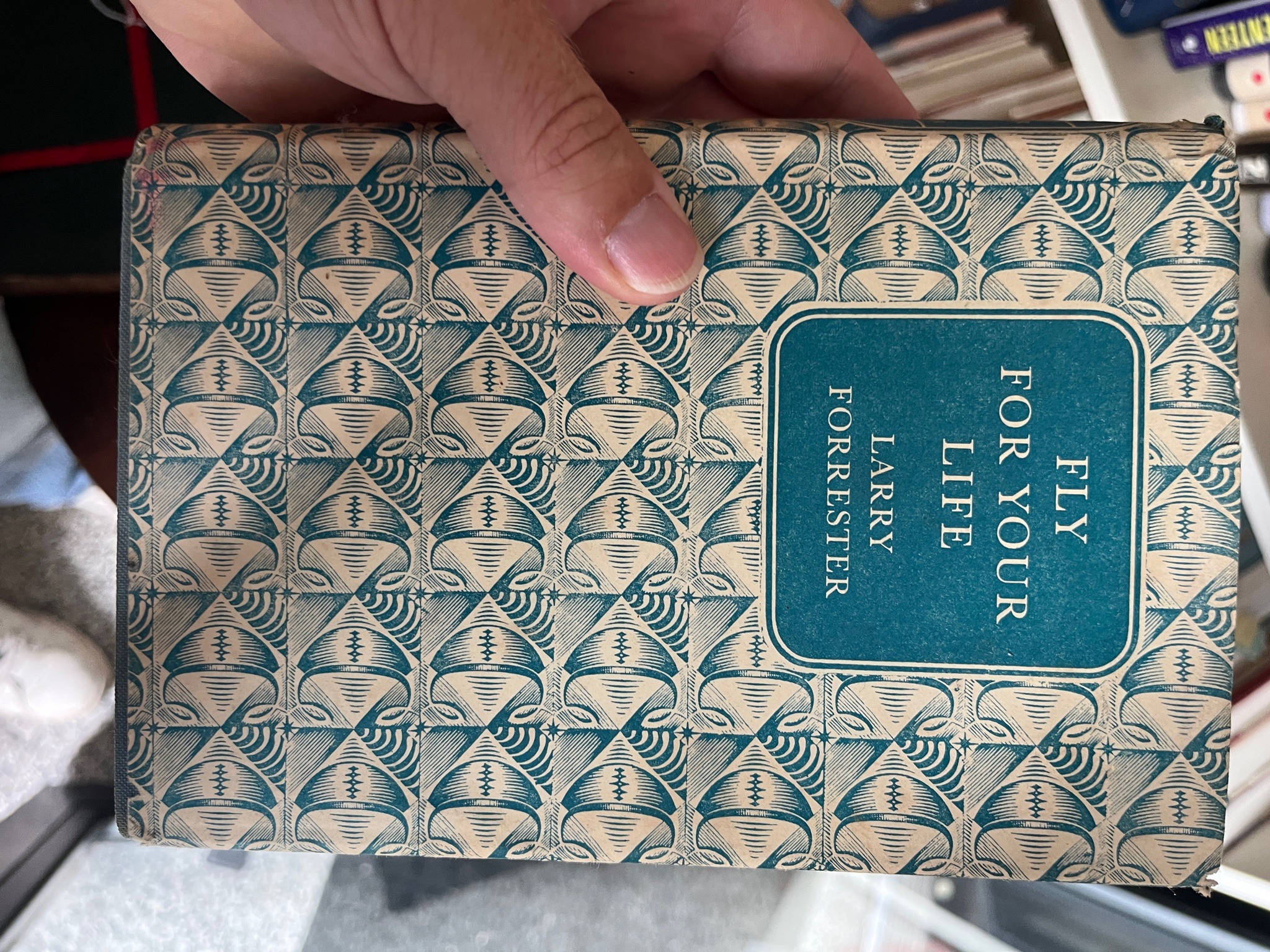 Submitted photo of Vintage hardcover book with pictorial dust jacket bearing text reading 'FLY FOR YOUR LIFE LARRY FORRESTER'