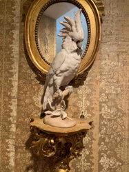 Porcelain Cockatoo Figurine on Gilded Wall Shelf with Oval Mirror