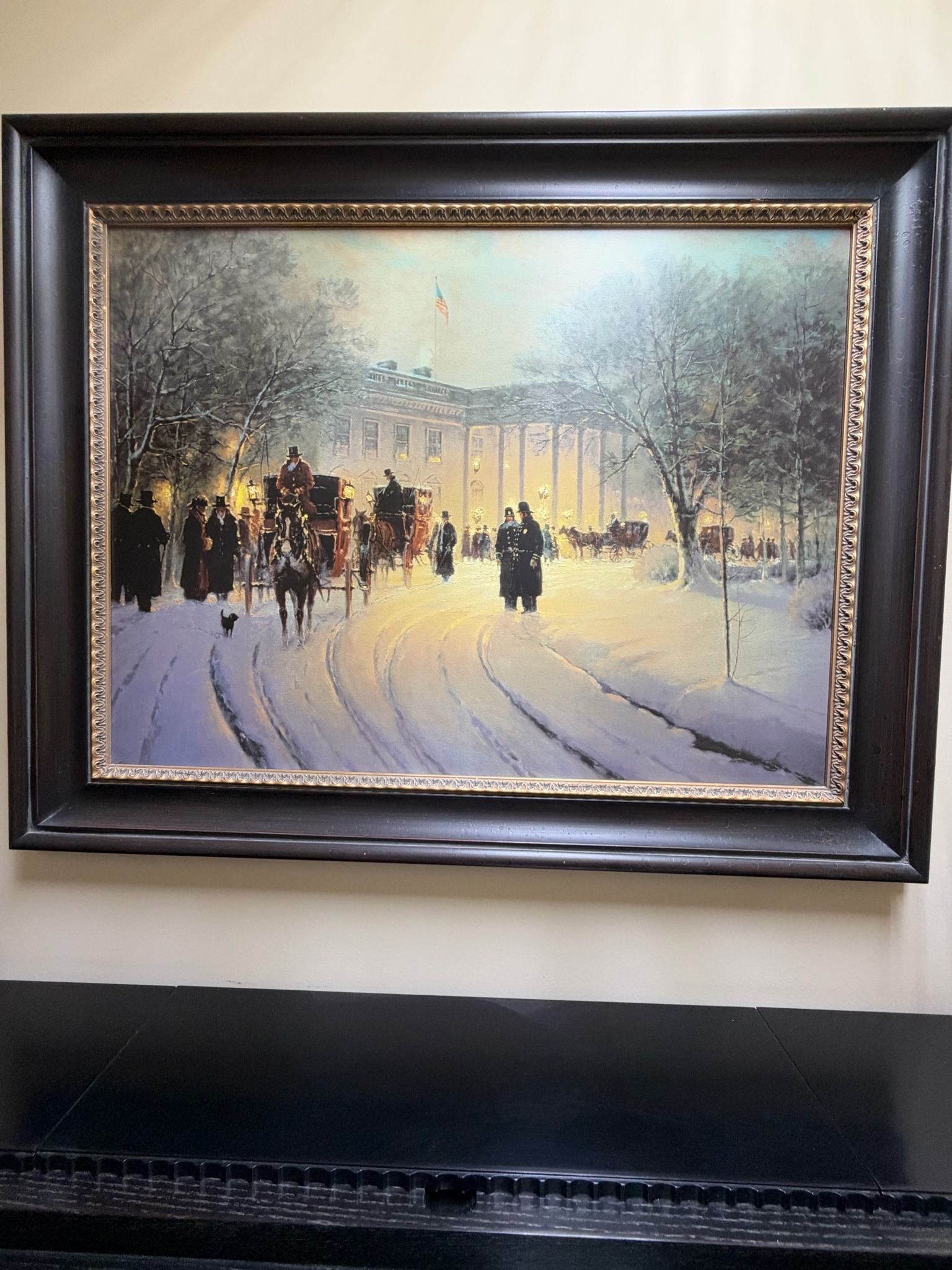 Submitted photo of Framed winter landscape painting depicting a historical scene