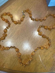 Amber-Colored Beaded Necklace with Floral and Leaf Motifs