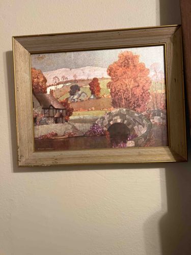 Framed Landscape Print depicting a Cottage and Stone Bridge
