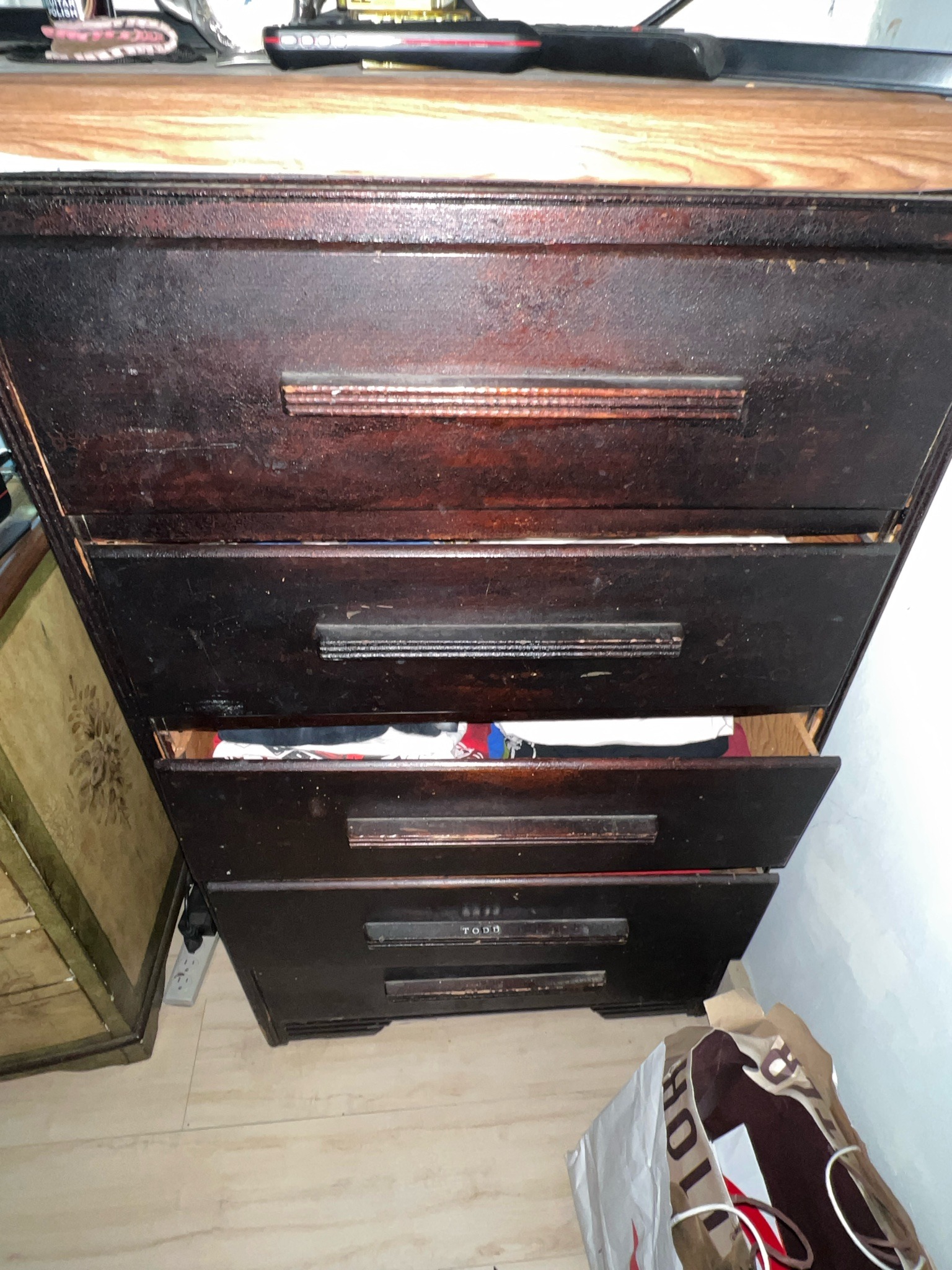 Submitted photo of Vintage dark-stained wooden chest of drawers