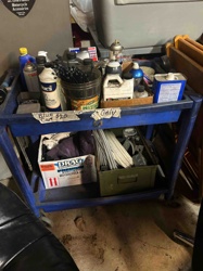 Blue Two-Tiered Utility Cart with Contents