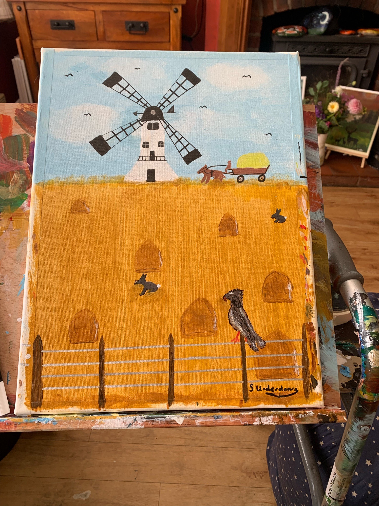 Submitted photo of acrylic landscape painting on stretched canvas in a naive folk art style