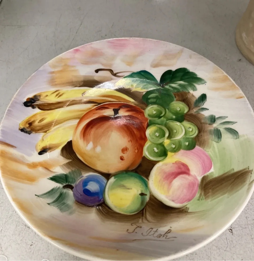 Submitted photo of Hand-painted ceramic decorative plate, signed 'T. Itoh'