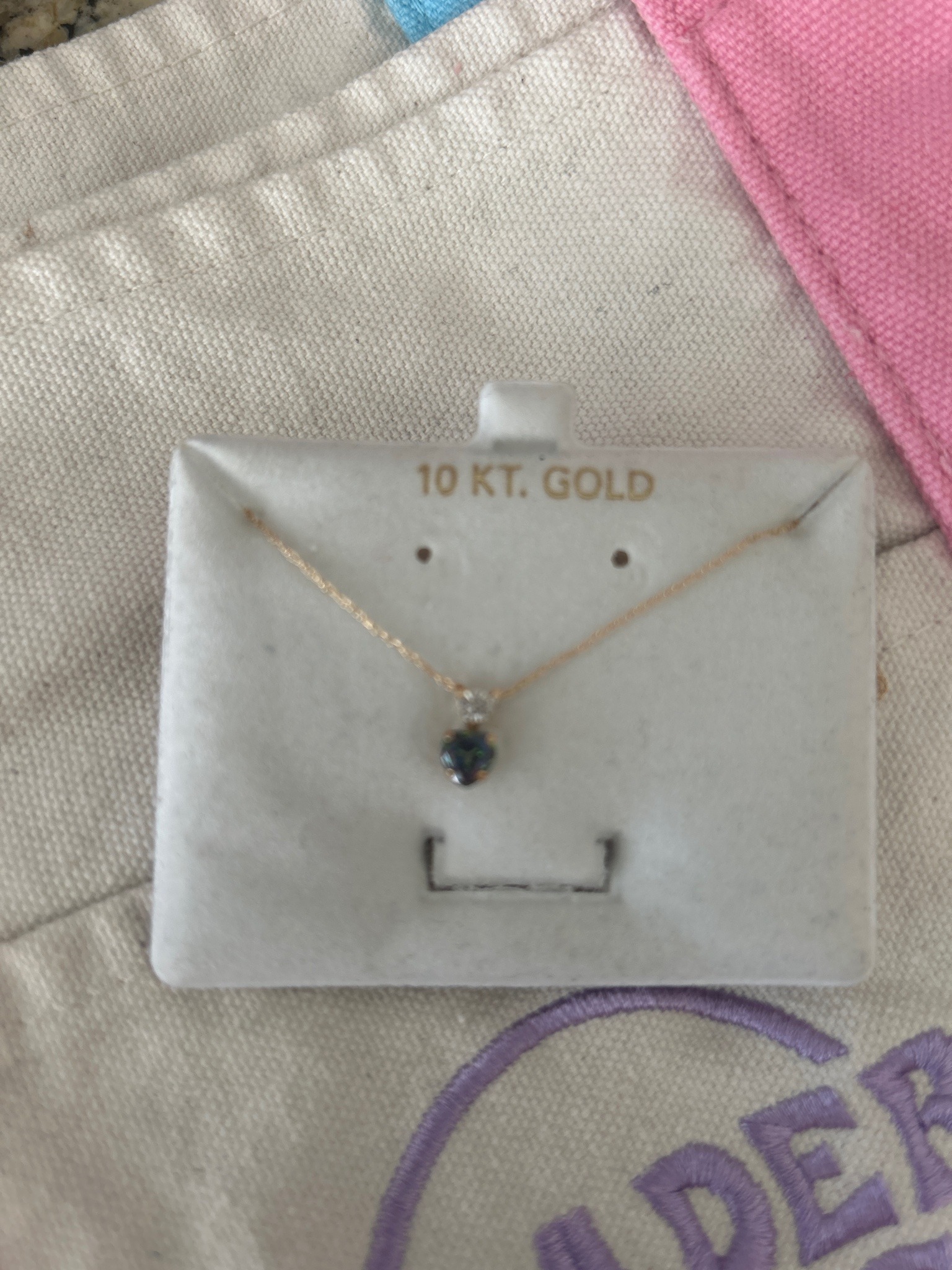 Submitted photo of Gold-Tone Fine Chain Necklace with Heart-Shaped Dark Gemstone Pendant