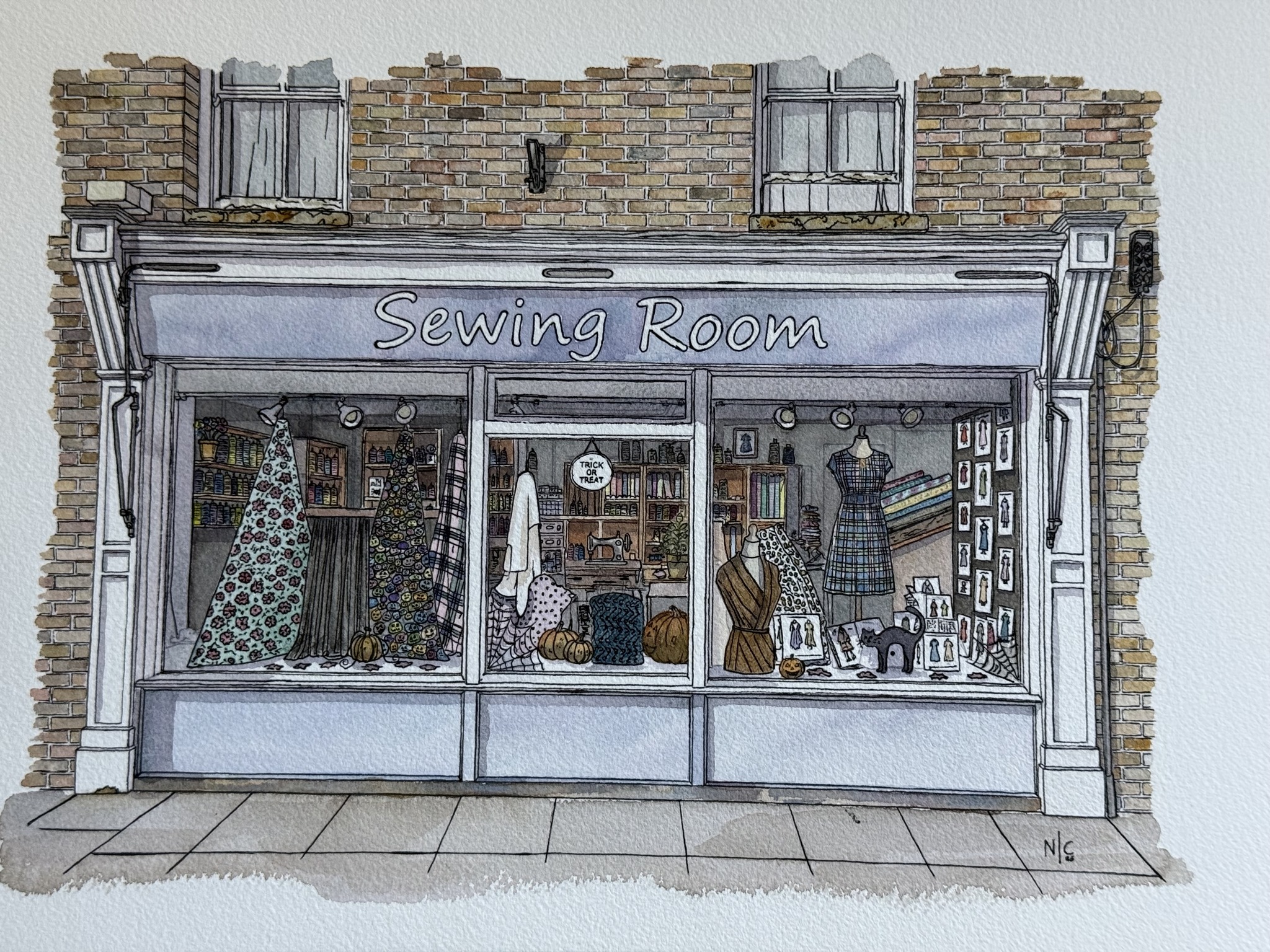 Submitted photo of Watercolor painting of a storefront signed 'N.C.'