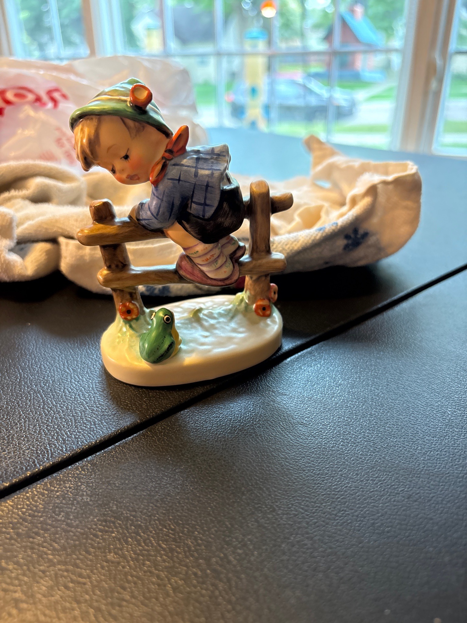 Submitted photo of Porcelain figurine, appears to be Hummel (not authenticated)