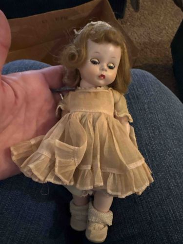 Vintage Hard Plastic Baby Doll with Sleep Eyes and Ruffled Dress