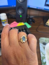 Gold Ring with Blue Gemstone and Diamond Halo