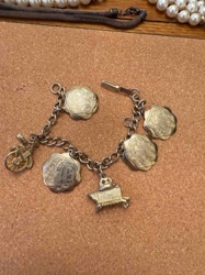 Vintage Charm Bracelet with Bicycle, Baby Bassinet, and Locket Charms