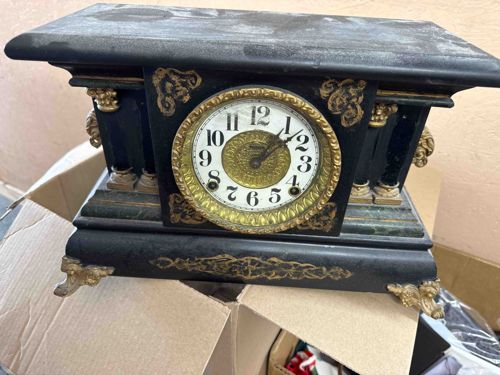 Antique Black Mantle Clock with Gilded Accents